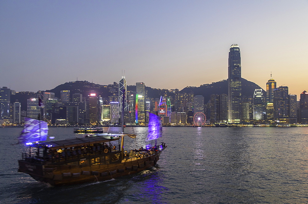 Junk boat in Victoria Harbour at dusk, Hong Kong Island, Hong Kong, China, Asia