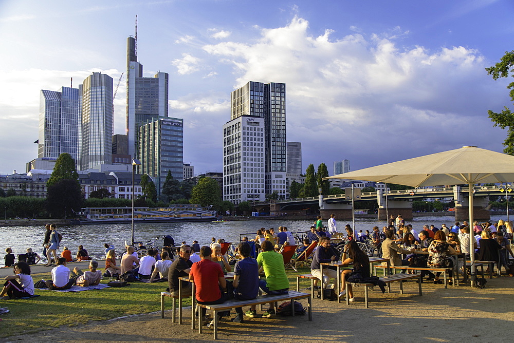 People sitting at outdoor bar beside River Main, Frankfurt, Hesse, Germany, Europe