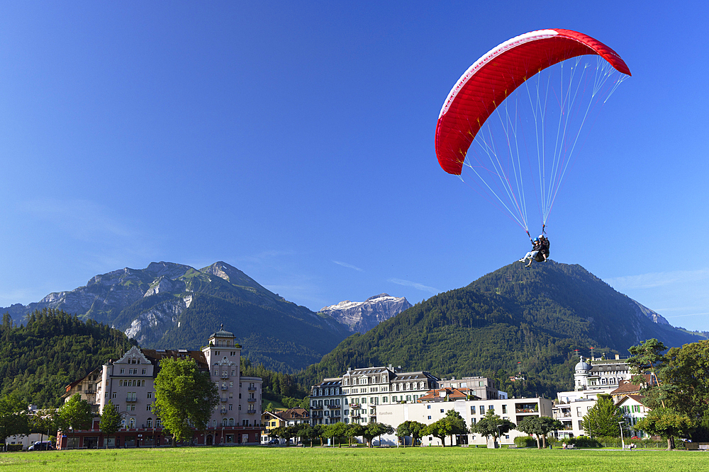 Paraglider over Hohematte Park, Interlaken, Bernese Oberland, Switzerland