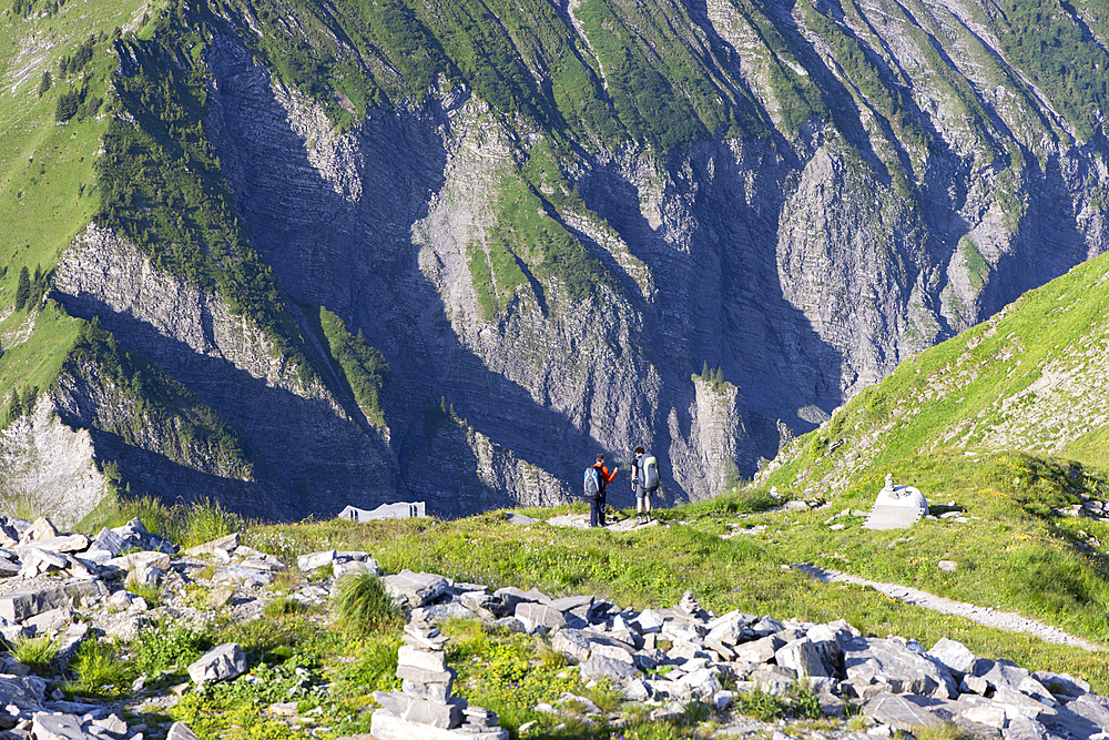 People hiking on Niesen mountain, Canton of Bern, Switzerland