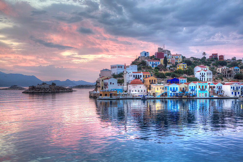 Sunrise, buildings at Harbour Entrance, Kastellorizo (Megisti) Island, Dodecanese Group, Greek Islands, Greece, Europe