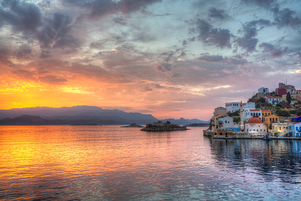 Sunrise, buildings at Harbour Entrance, Kastellorizo (Megisti) Island, Dodecanese Group, Greek Islands, Greece, Europe