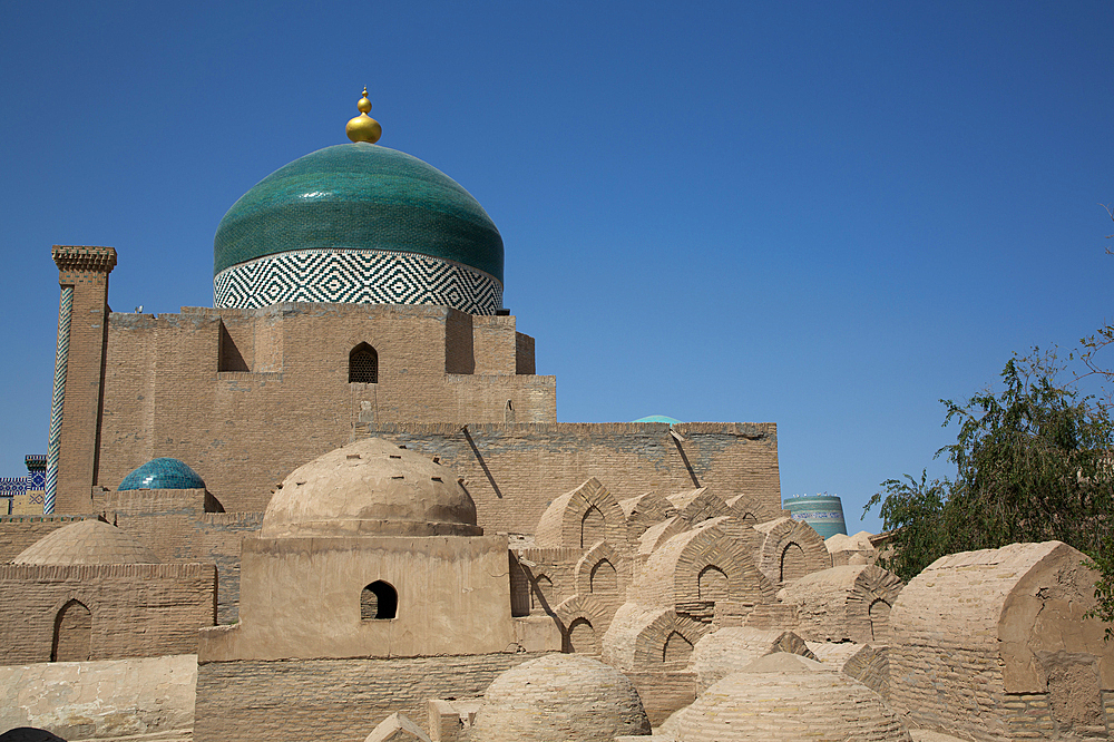 Tombs in the foreground, Timurid-style Dome, Pakhlavon Mahmud Mausoleum, Ichon Qala (Itchan Kala), UNESCO World Heritage Site, Khiva, Uzbekistan, Central Asia, Asia