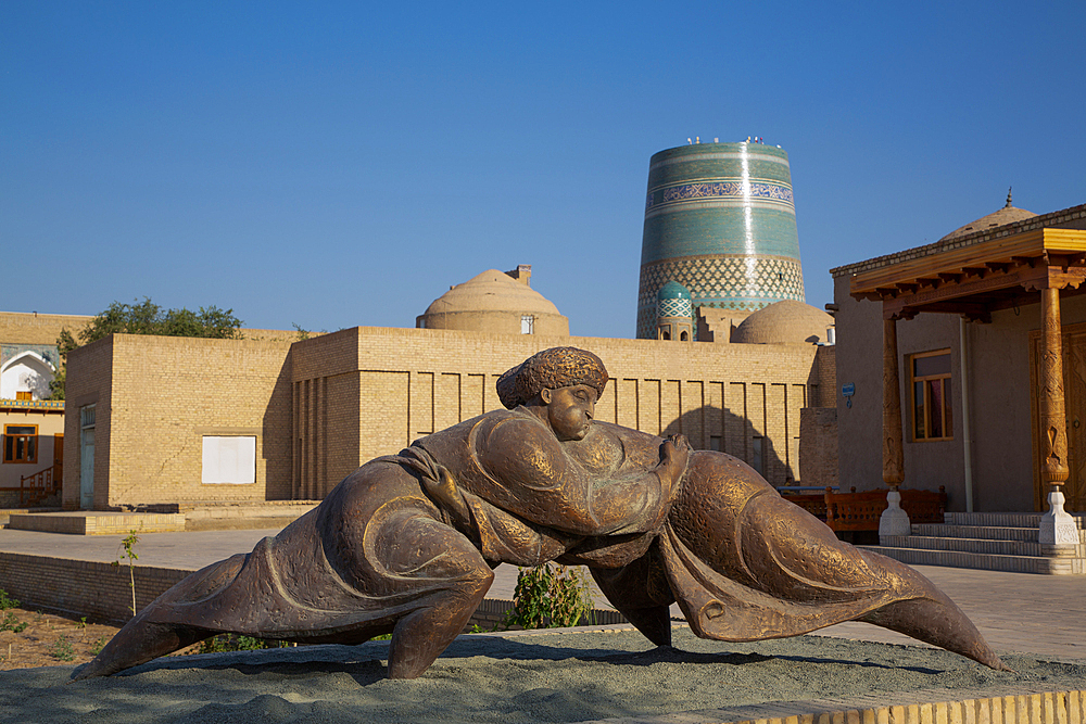 Sculpture with Kalta Minaret in the background, Ichon Qala (Itchan Kala), UNESCO World Heritage Site, Khiva, Uzbekistan, Central Asia, Asia