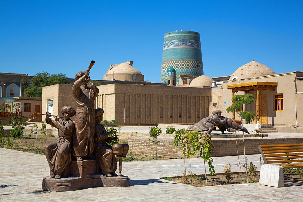 Sculpture with Kalta Minaret in the background, Ichon Qala (Itchan Kala), UNESCO World Heritage Site, Khiva, Uzbekistan, Central Asia, Asia