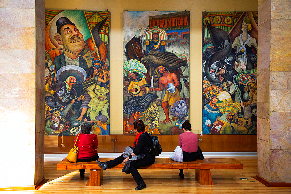 Tourists viewing frescoes by Diego Rivera, Palacio de Bellas Artes (Palace of Fine Arts), UNESCO World Heritage Site, Mexico City, Mexico, North America