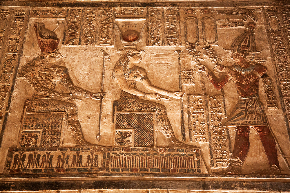 Reliefs of the God Horus on left, with Goddess Hathor in center and Pharaoh on right, Sanctuary, Temple of Hathor, Dendera, Qena, Egypt, North Africa, Africa