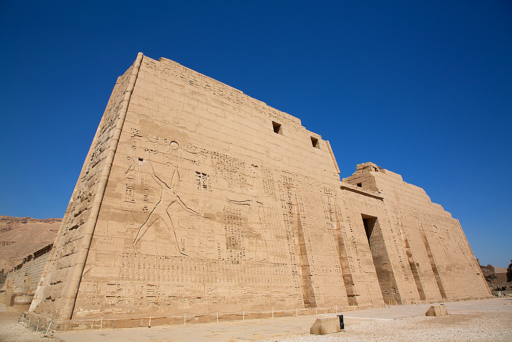 First Pylon, Medinet Habu, Mortuary Temple of Ramesses III, 1187-56 BCE, Ancient Thebes, UNESCO World Heritage Site, Luxor, Egypt, North Africa, Africa