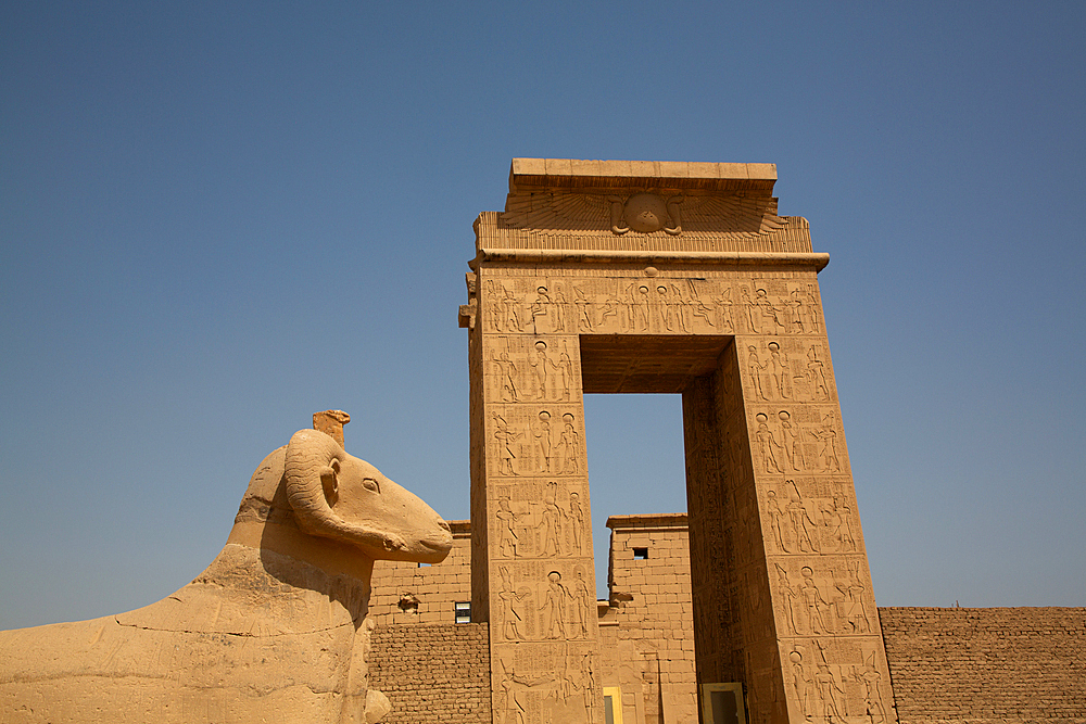 Gate to the Temple of Khonsu, Ram-Headed Sphinx in foreground, Karnak Temple Complex, UNESCO World Heritage Site, Luxor, Egypt, North Africa, Africa