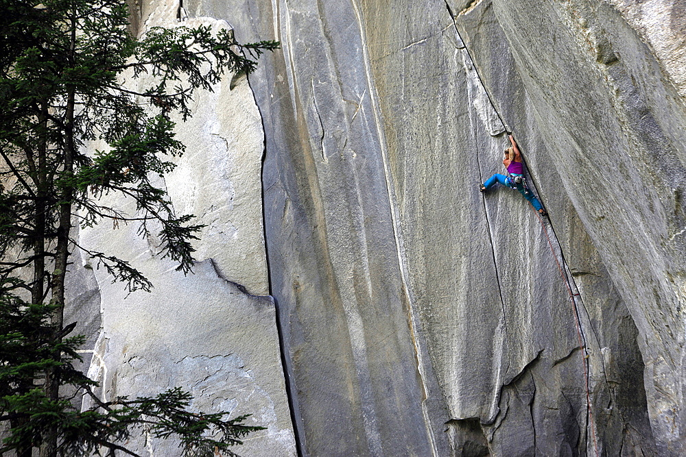 A climber scales cliffs at Cadarese, northern Italy, Europe