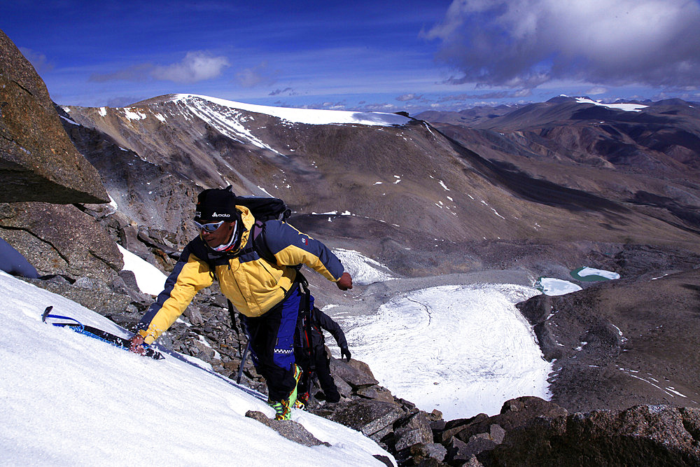 A climber ascending Mentok I, 6200m, high above Tso Mori lake, Ladakh, Himalayas, India, Asia