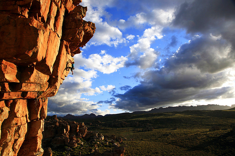 A climber scales cliffs in The Cederberg, Western Cape, South Africa, Africa