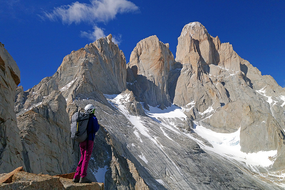 A mountaineer looks up towards Cerro Fitz Roy, El Chalten Massif, Patagonia, Argentina, South America