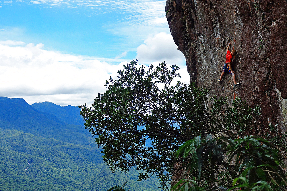 A rock climber scales the famous granite cliffs of Marumbi, a mountain in Parana State, south Brazil, South America