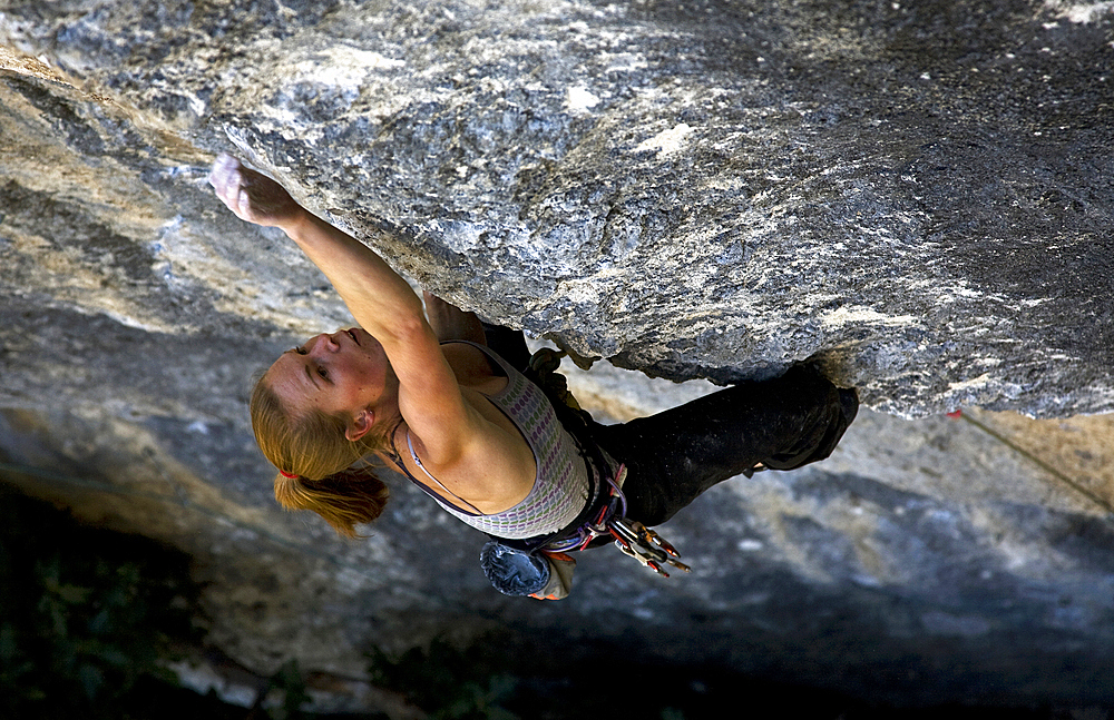 A rock climber in action on cliffs at Rodellar, Huesca Province, Aragon, Spain, Europe