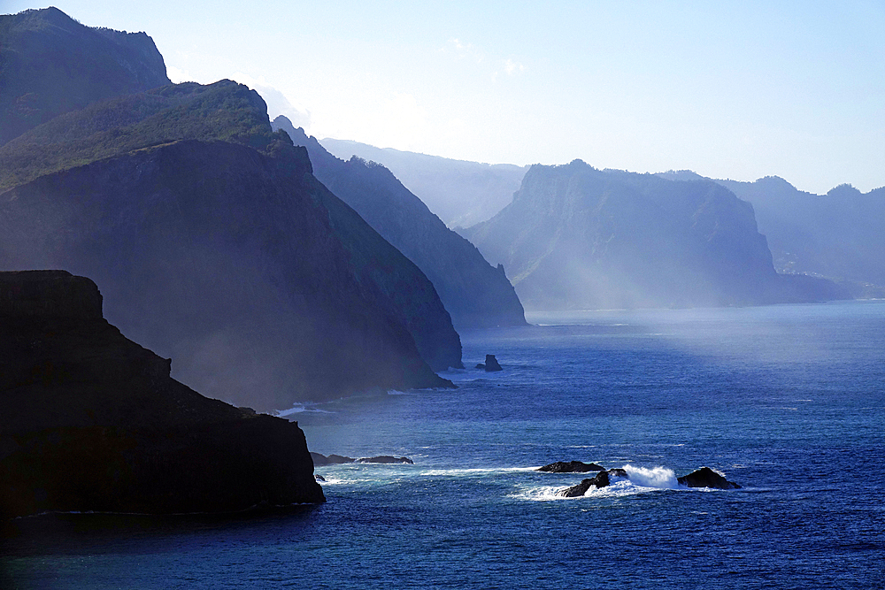 The dramatic sea cliffs of the northwest coast rise beyond the Sao Lourenco peninsula, eastern Madeira, Portugal, Atlantic Ocean, Europe