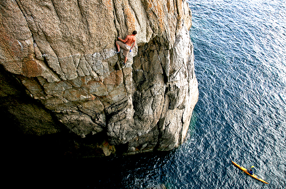 Rock climber in action, Lundy Island, North Devon, England, United Kingdom, Europe