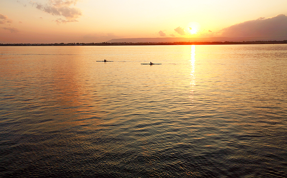 Canoeists at sunset, Ortigia, Sicily, Italy, Mediterranean, Europe