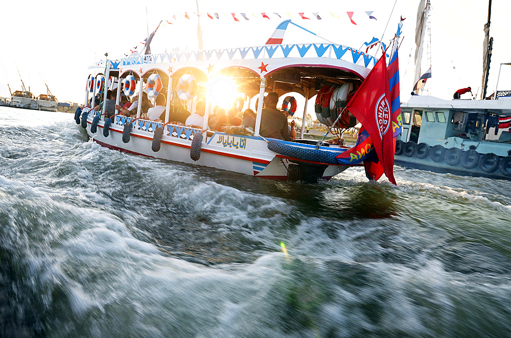 Boats racing on the River Nile at sunset, Luxor, Egypt, North Africa, Africa