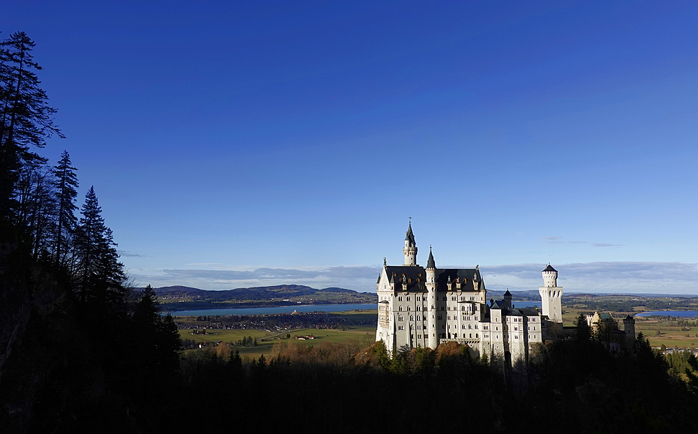 Neuschwanstein Castle, Southern Bavaria. This 19th-century historicist palace is built on a rugged hill of the foothills of the Alps in the very south of Germany and is a UNESCO World Heritage site.