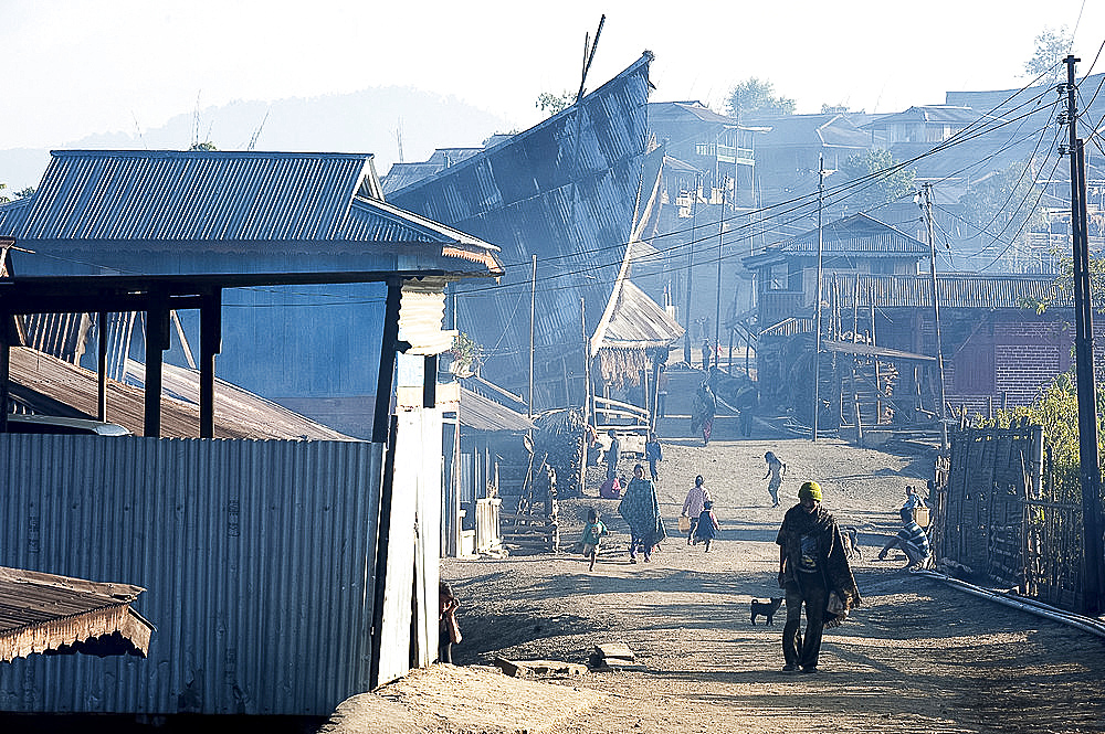 Naga villagers in the early morning, going about their business in Chanlangshu Naga village, Nagaland, India, Asia