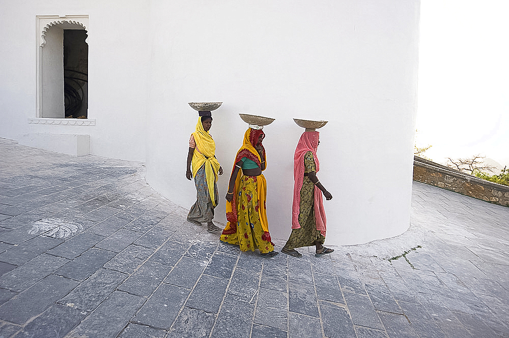 Three female construction workers at the Monsoon Palace, Udaipur, Rajasthan, India