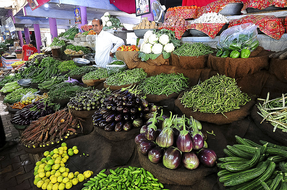 Vegetable stall with a variety of fresh vegetables for sale in the main city vegetable market in Bhuj, Gujarat, India, Asia