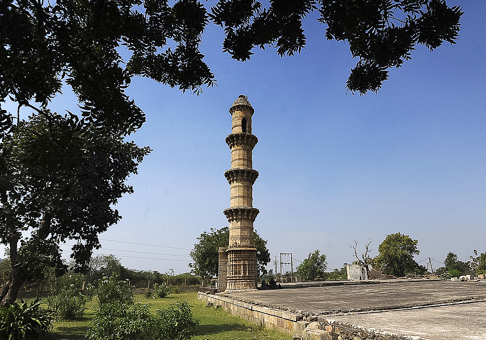 Single minaret remaining on a high plinth from Bahadur Shah's mosque built between 1526-36, Champaner, Gujarat, India, Asia