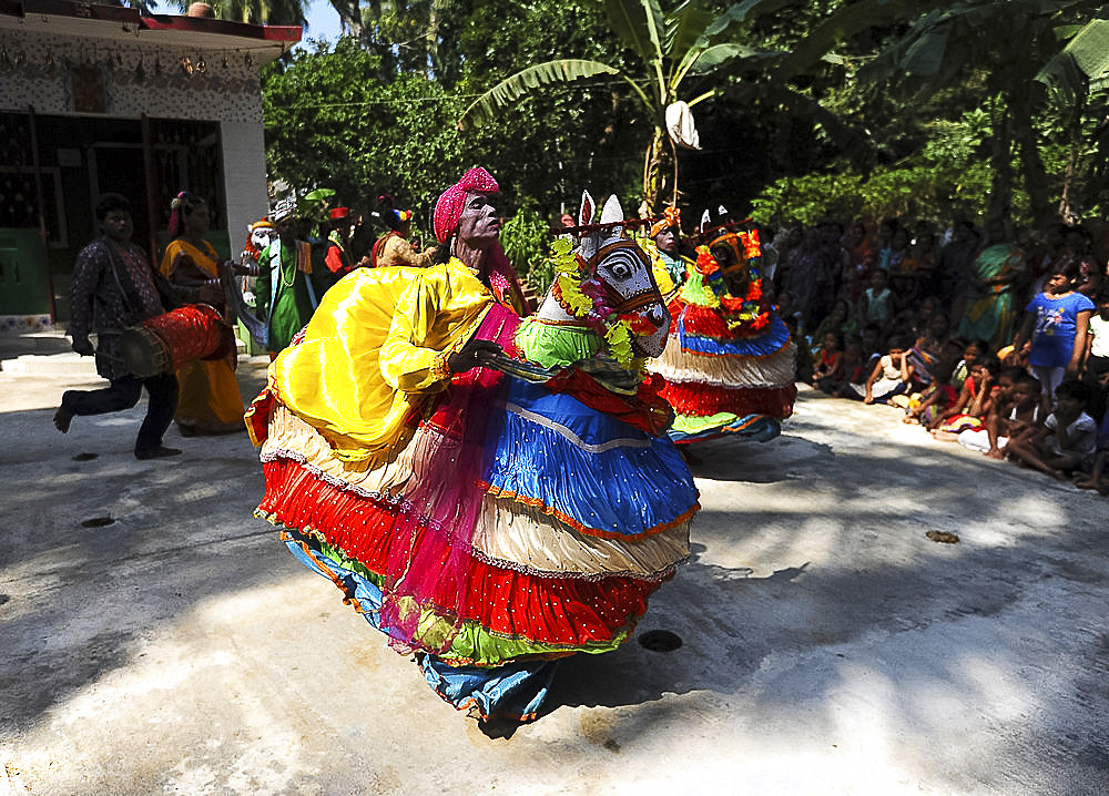 Main character Rautani performing traditional Chaiti Ghoda (Dummy Horse) dance at village event, Odisha, India, Asia