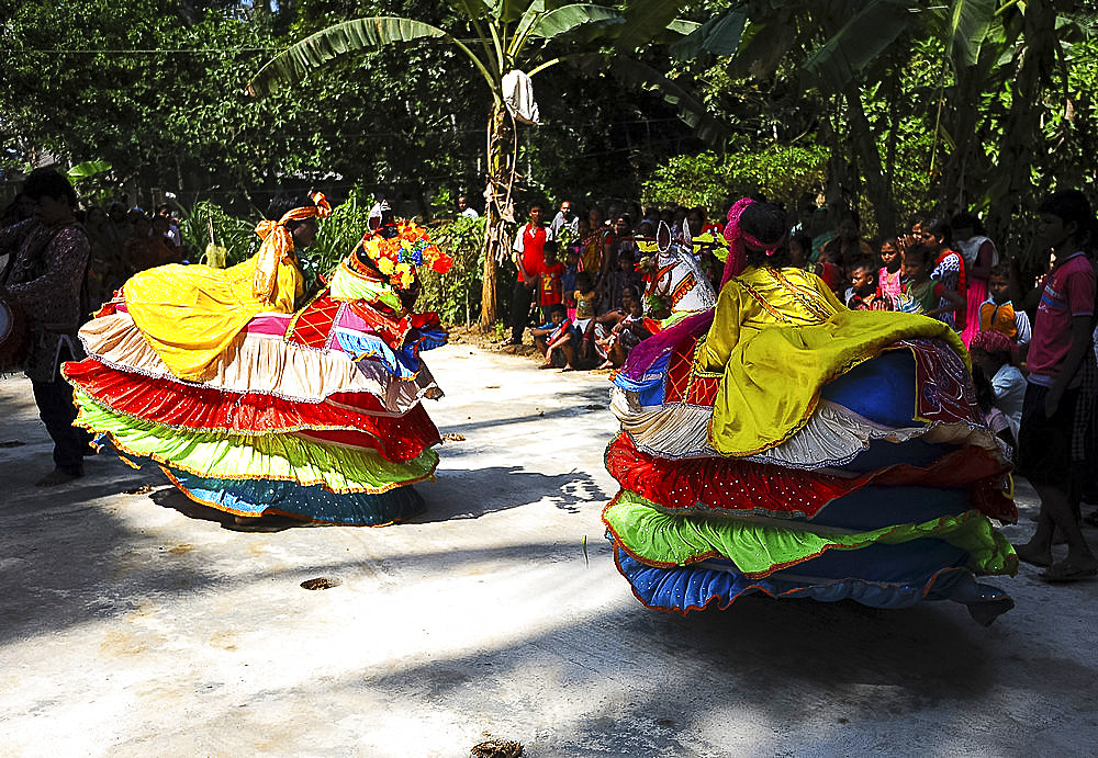 Group of Chaiti Ghoda (Dummy Horse) dancers performing traditional dance at rural village event, Odisha, India, Asia