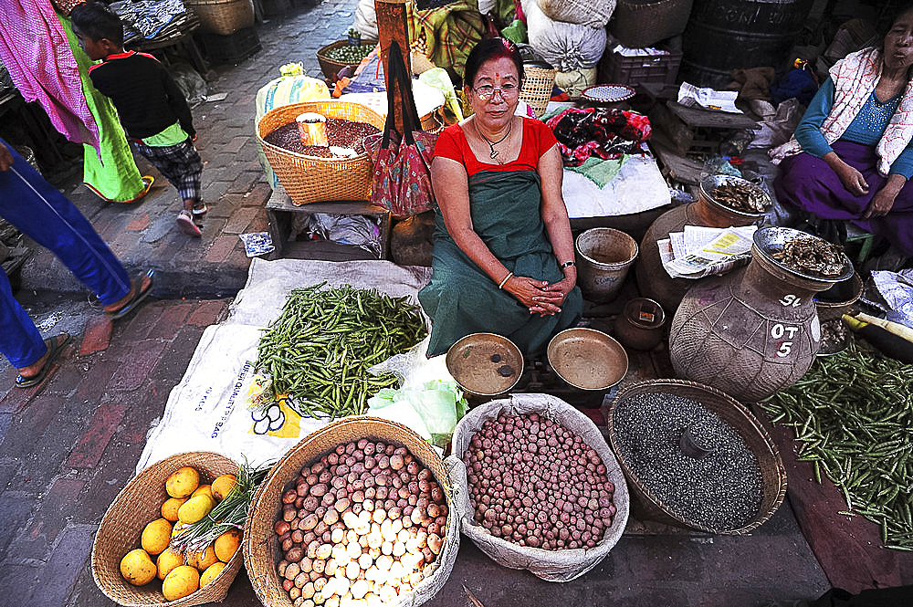 Woman selling vegetables and black rice in Ima women's market, Imphal, Manipur, India, Asia