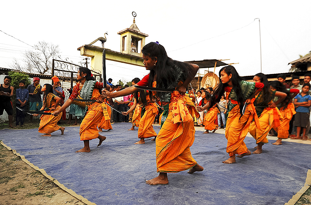 Assamese village women in Assam state dress, performing knife dance in front of villagers, Sualkuchi district, Assam, India, Asia