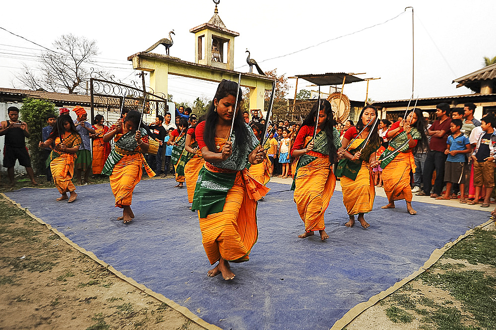 Assamese village women in Assam state dress, performing knife dance in front of villagers, Sualkuchi district, Assam, India, Asia