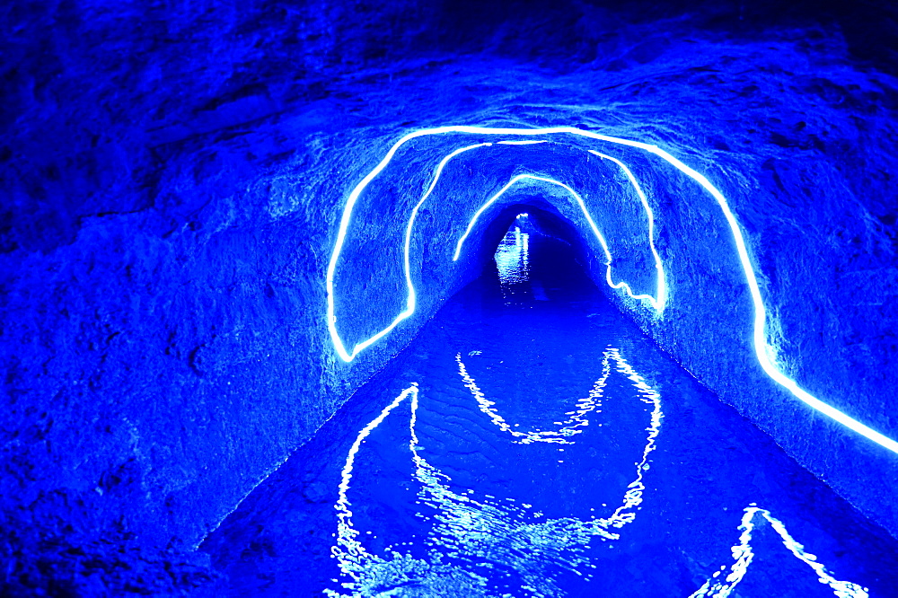 Illuminated underground karez (water canals) in the oasis town of Turpan, Silk Road, Xinjiang, China, Asia