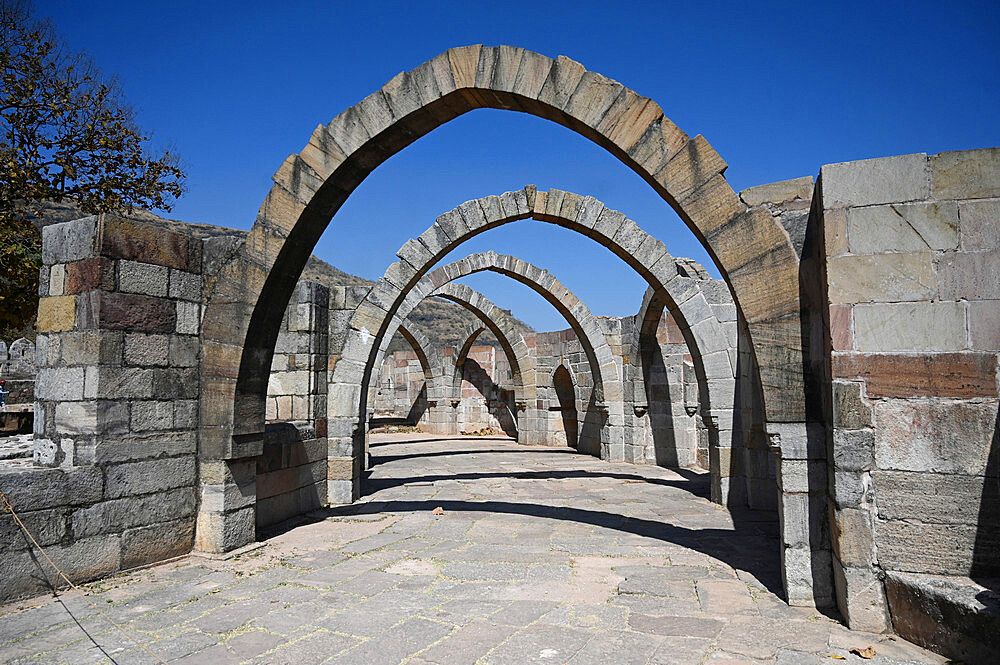 Five arches, the remains of 15th century hilltop Saat Kaman (Seven Arches) monument, part of the Champaner complex, Gujarat, India, Asia