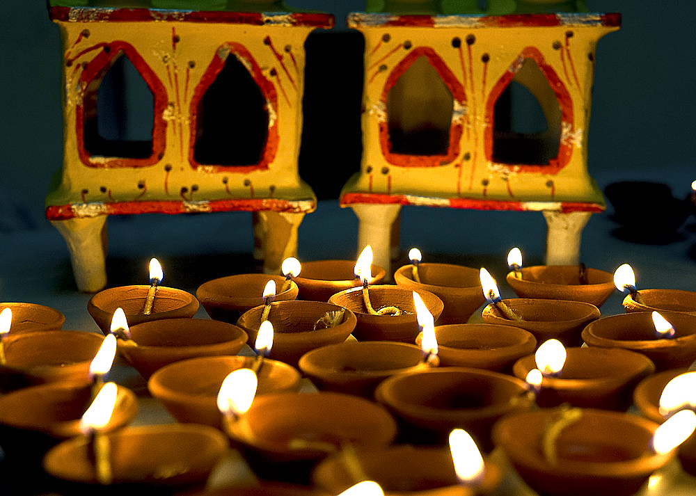 Diwali deepak lights (oil and cotton wick candles) and shrine decorations, India, Asia