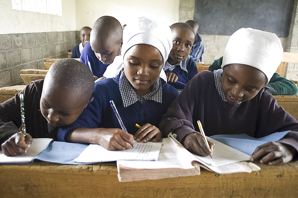 Schoolgirls working in a classroom, Langalanga Primary School, Gilgil district, Rift Valley, Kenya, East Africa, Africa