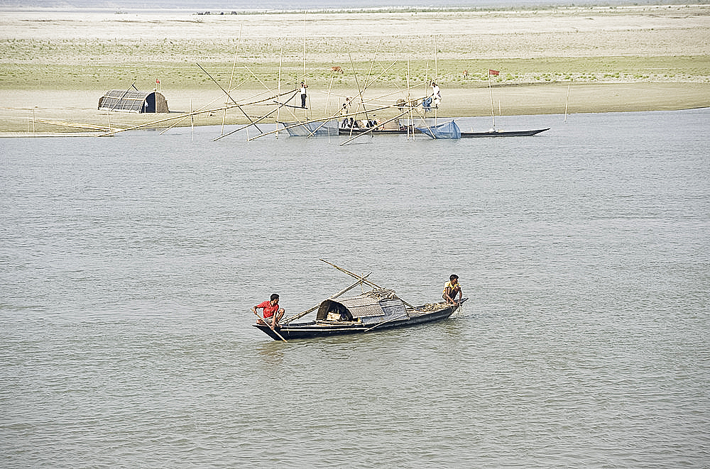 Fishermen, nets and boats on the Brahmaputra River, near Guwahati, Assam, India, Asia