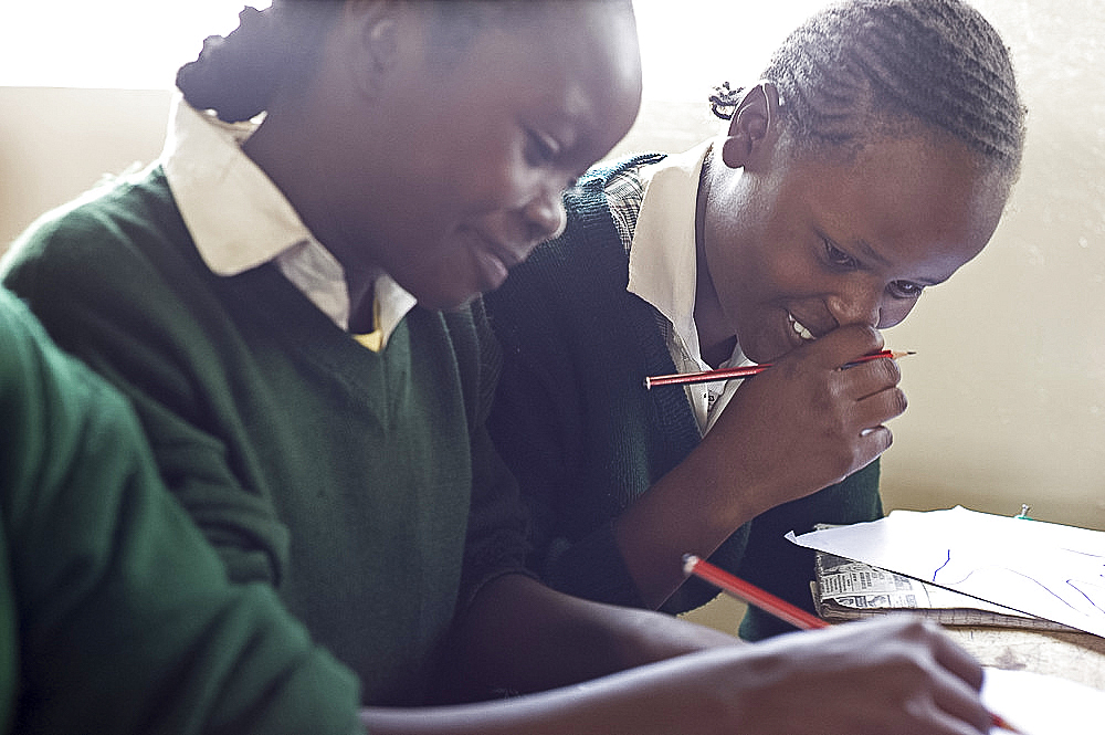 Schoolgirls working in class, Ngumo Primary School, Rift Valley, Kenya, East Africa, Africa