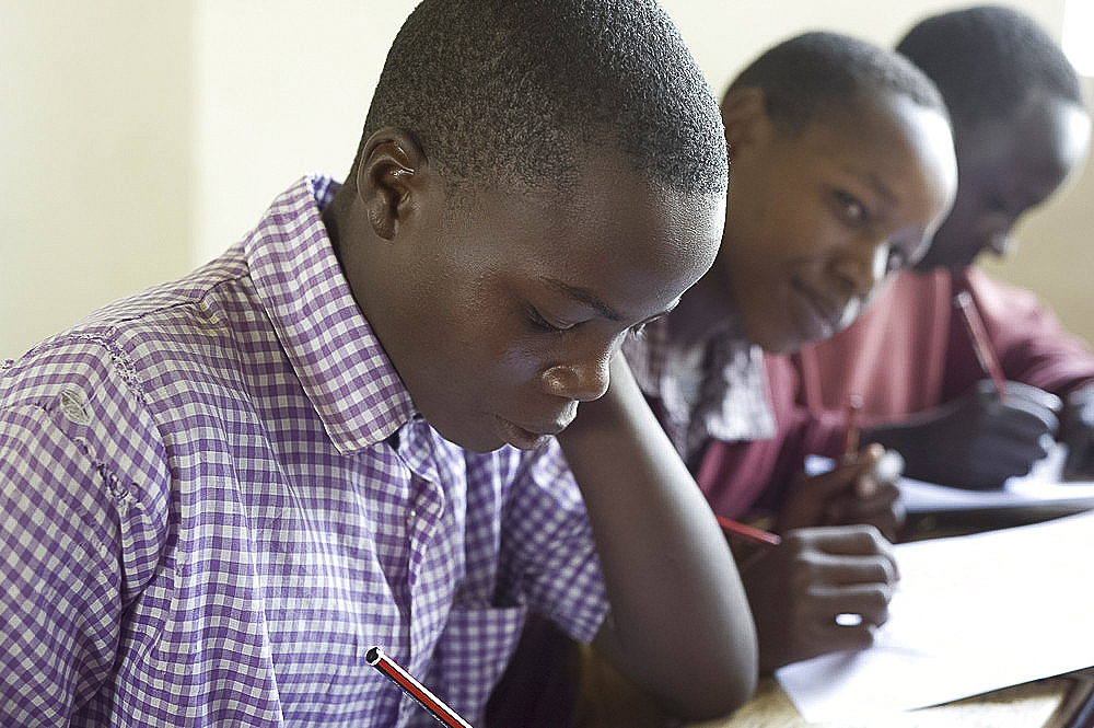 Schoolboys working in class, Ngumo Primary School, Rift Valley, Kenya, East Africa, Africa