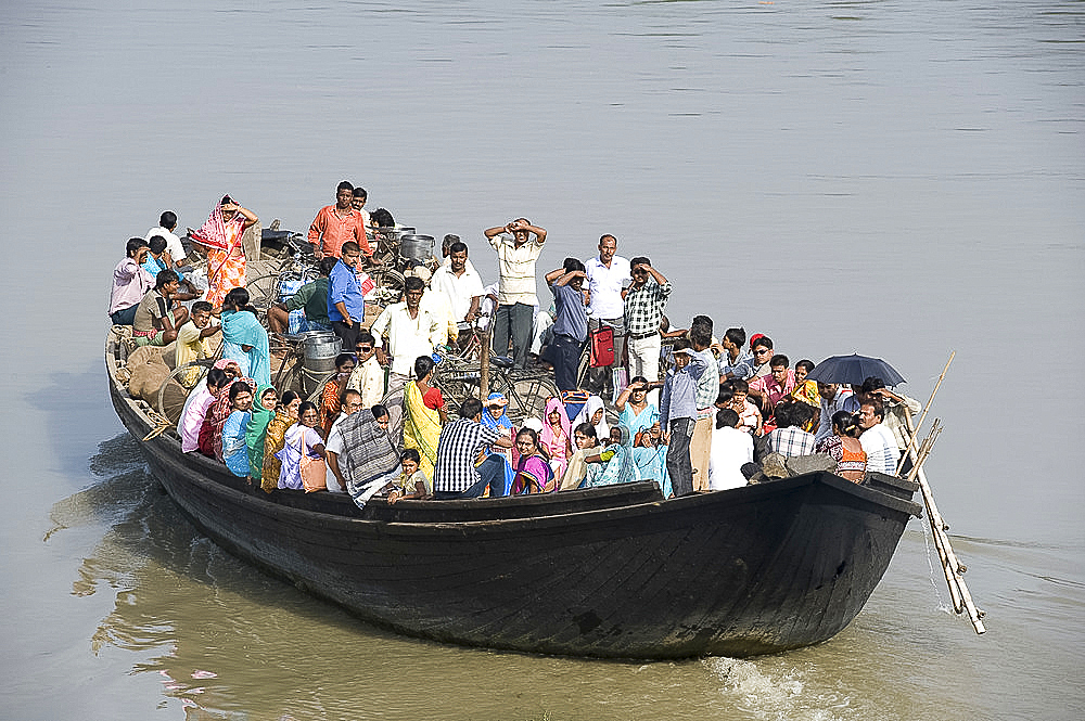 Crowded village ferry crossing the River Hooghly, West Bengal, India, Asia