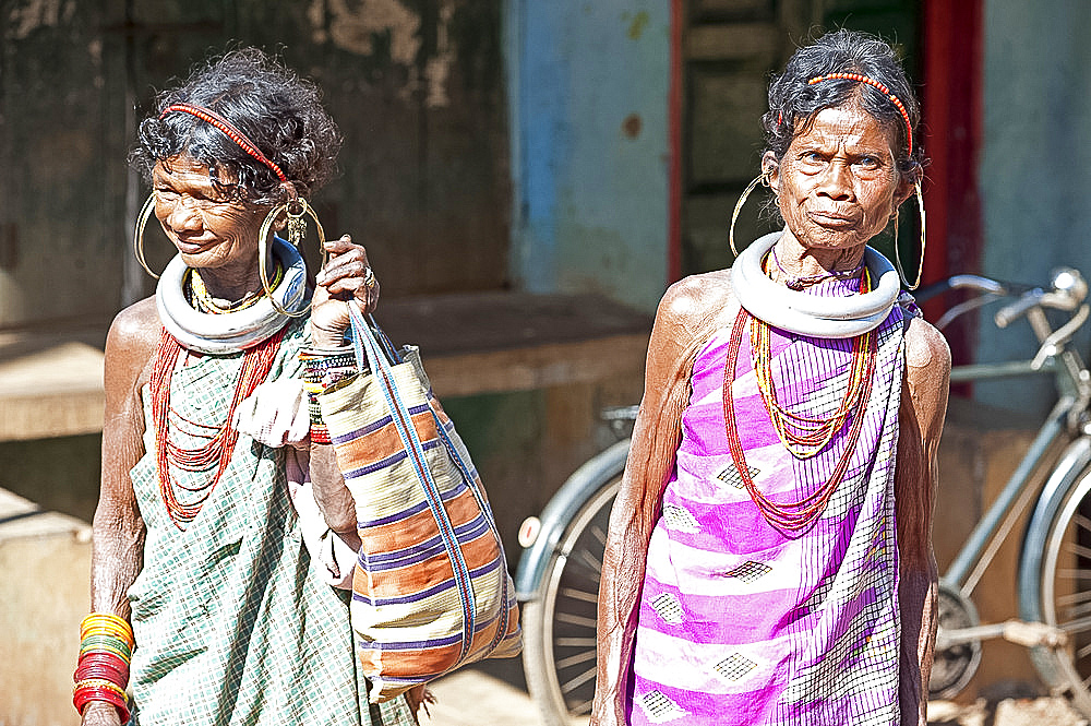 Two Gadaba tribeswomen each with traditional jewellery denoting their tribe, at Bonda tribal street market, Rayagader, Orissa, India, Asia