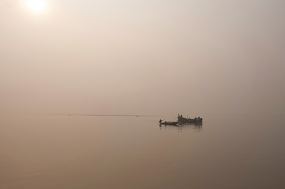 Fishing boats and ferry on the River Ganges in the early morning, Sonepur, Bihar, India, Asia