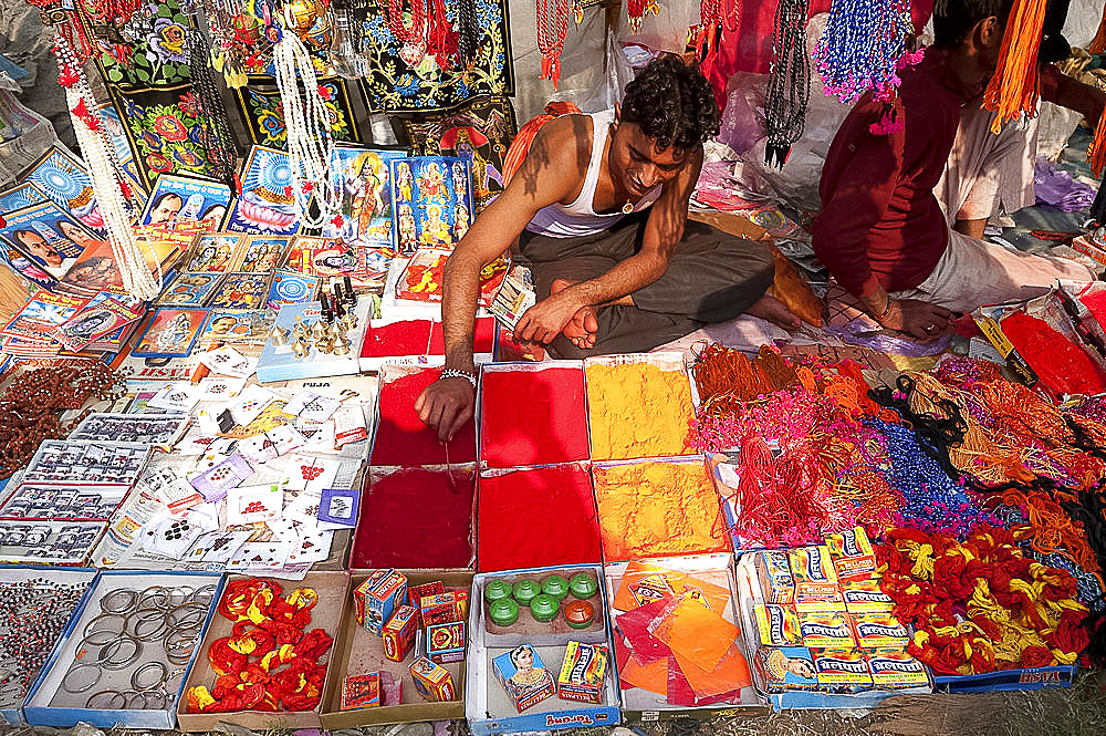 Man selling abir, a red powder used for marking teeka on the forehead, and other Hindu trinkets, Sonepur, Bihar, India, Asia