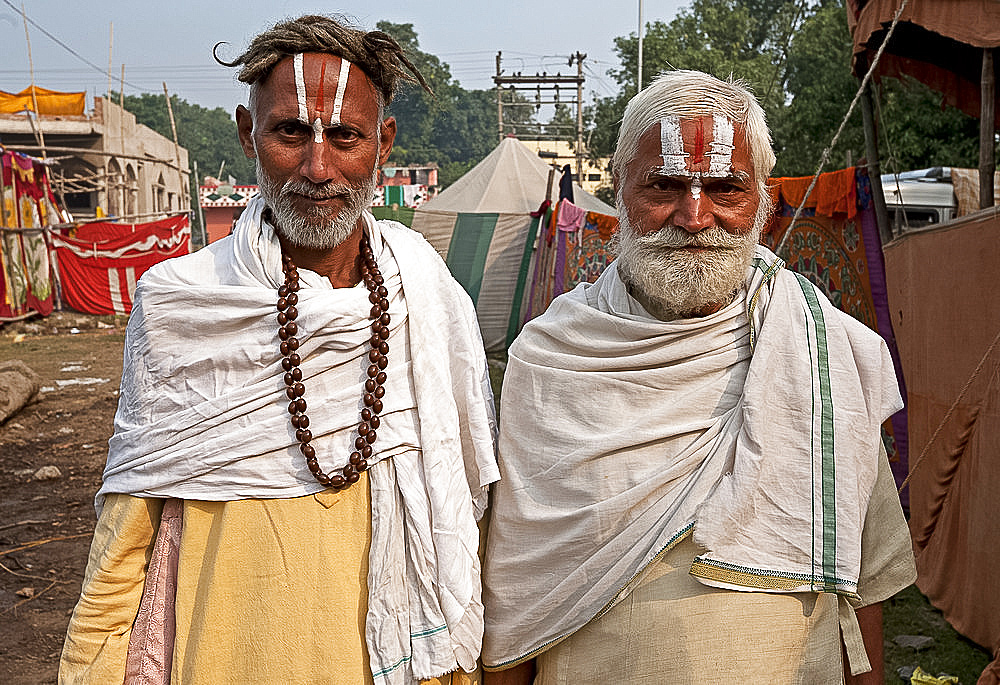 Two men with Vaishnavite sandalwood tilaks on their foreheads, one man with long uncut hair, Sonepur Cattle Fair, Bihar, India, Asia