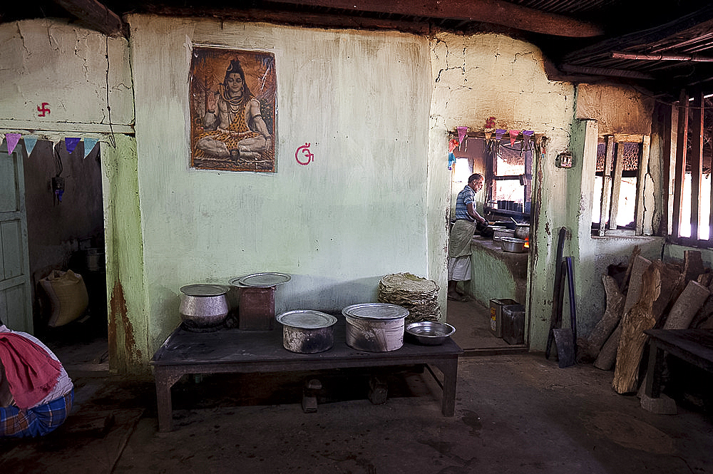 Man cooking in roadside dhaba (restaurant), rural Orissa, India, Asia