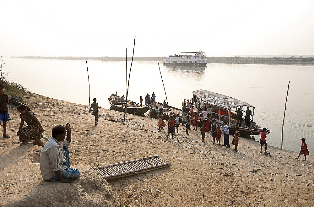 Activity around ferry arrival on the banks of the River Hugli (River Hooghly), rural West Bengal, India, Asia