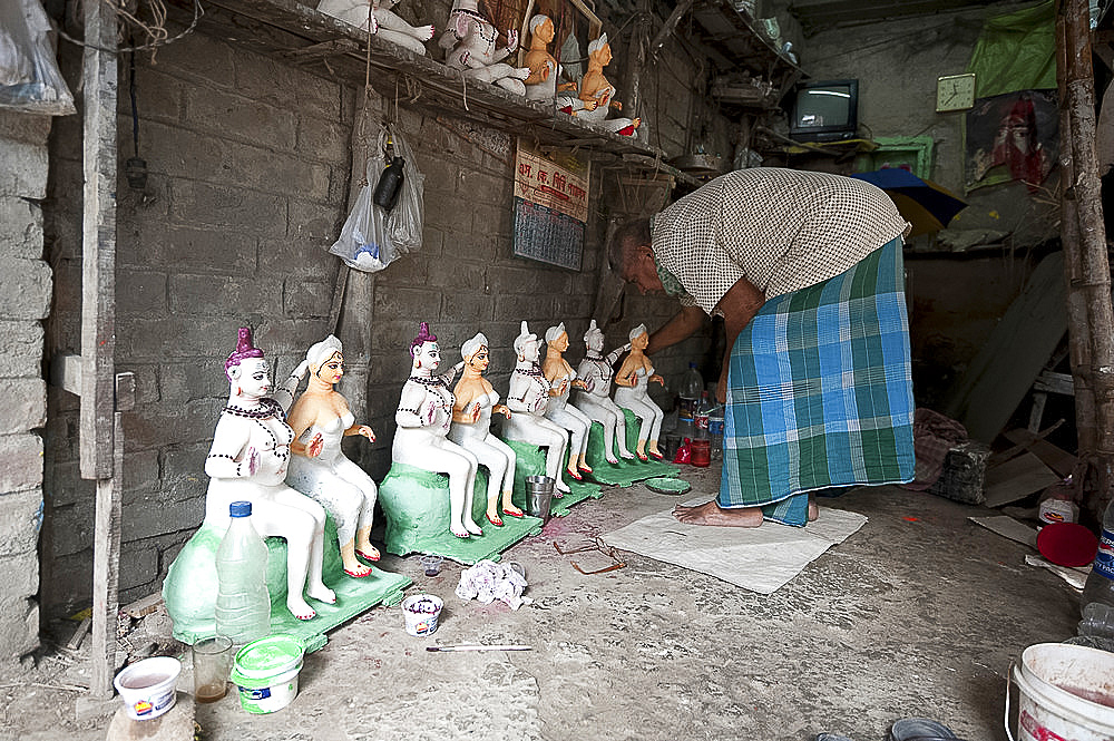 Deity maker with his deities, Kumartuli district, Kolkata, West Bengal, India, Asia