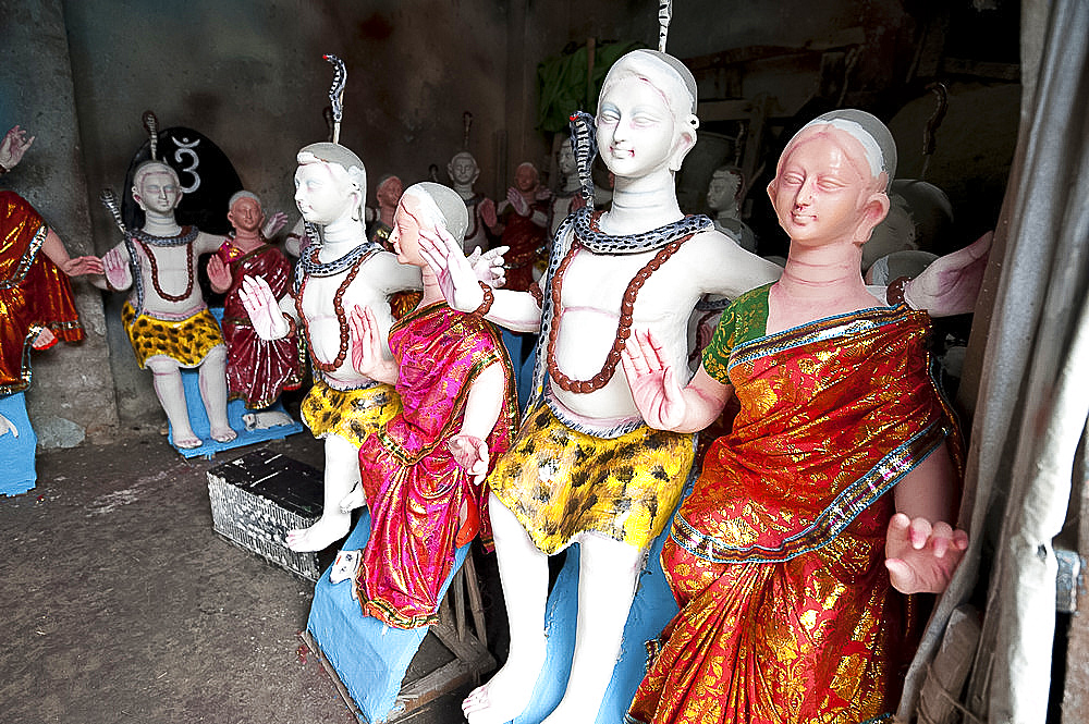 Finished, painted and dressed deities ready for offering at festival pujas, Kumartuli district, Kolkata, West Bengal, India, Asia