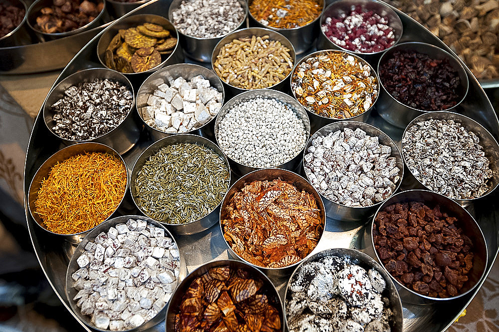 Various types of sonf, mouth freshener, in aluminium pots, some coated in silver, in sonf stall in market, Kolkata, West Bengal, India, Asia